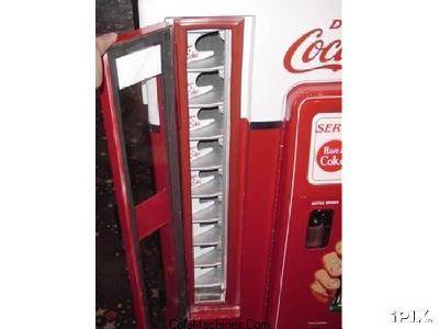 Bottle door detail on a vintage Coca-Cola machine