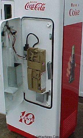 Original coin door detail on a vintage soda machine